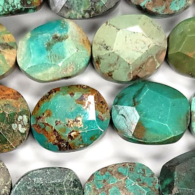 CHINESE TURQUOISE FACETED FLAT OVAL 20X22-24X25MM